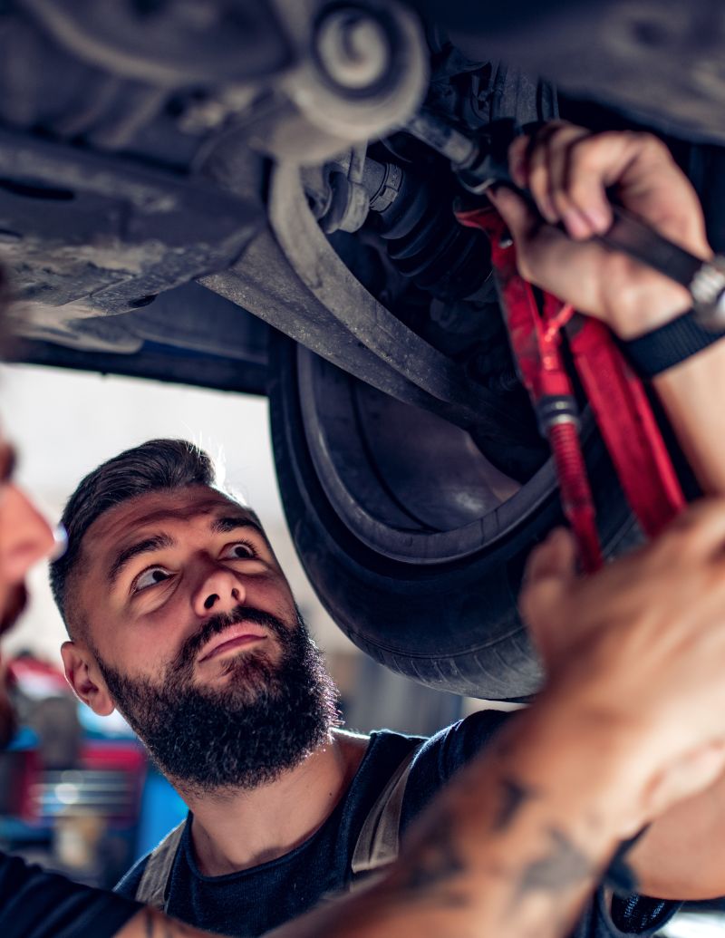 2 mechanics under the car 